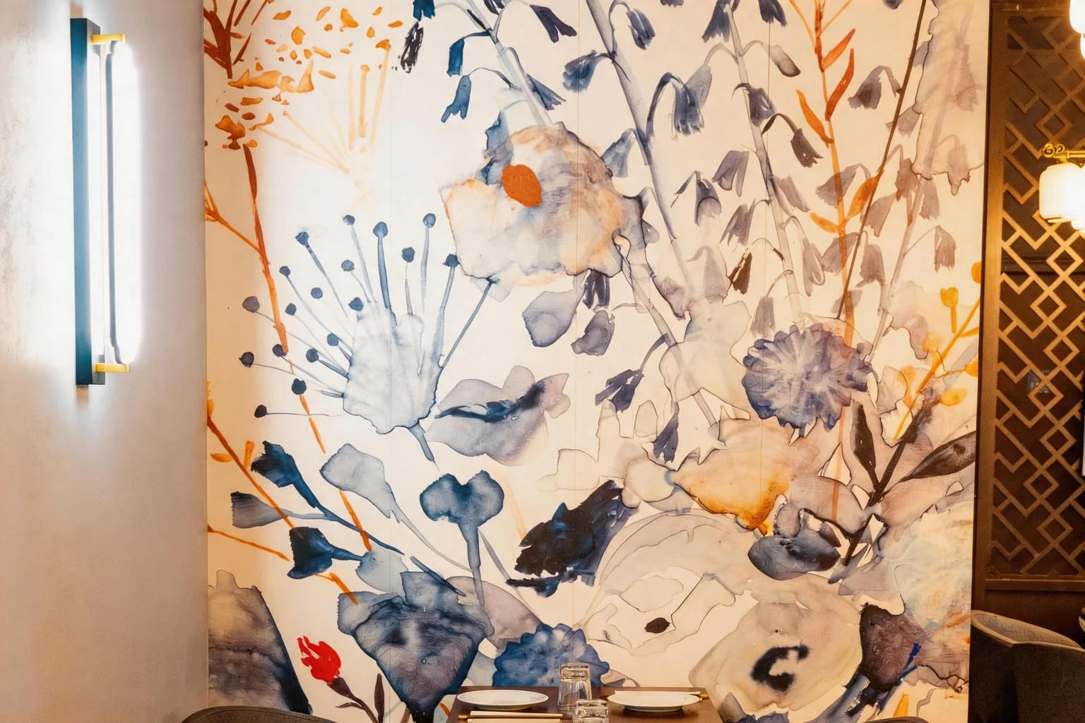 Blue floral mural, wall light and set tables